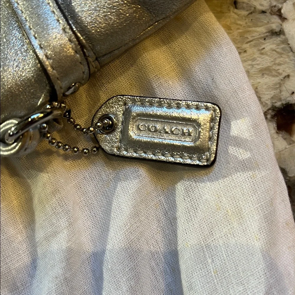 Coach Silver leather wristlet. Pre-Owned Condition-Very Good. - Picture 3 of 9